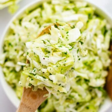 shredded cabbage and cucumber salad bowl.