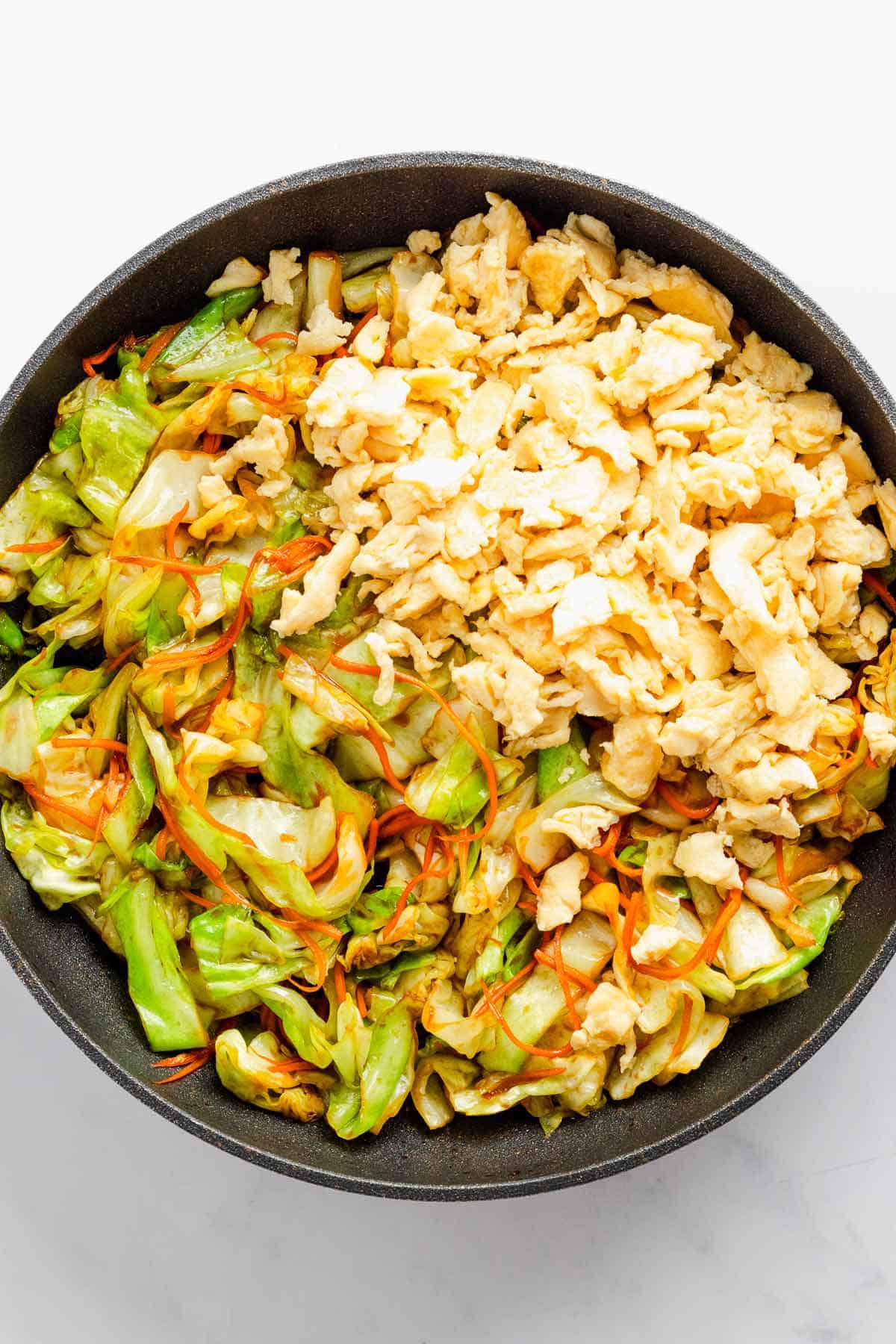 cabbage stir fry with veggies and eggs and soy sauce.