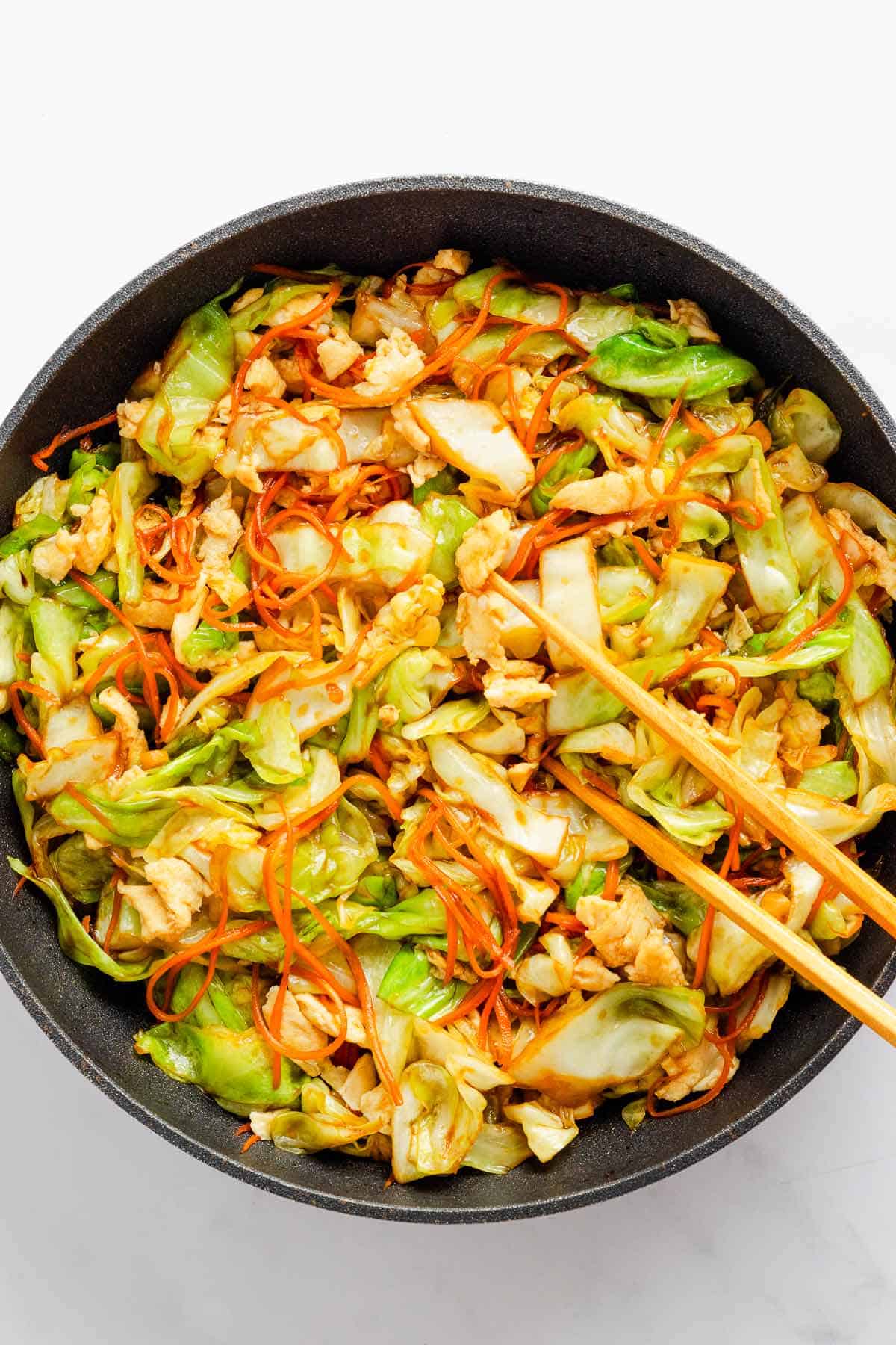 cabbage stir fry with veggies and eggs and soy sauce.