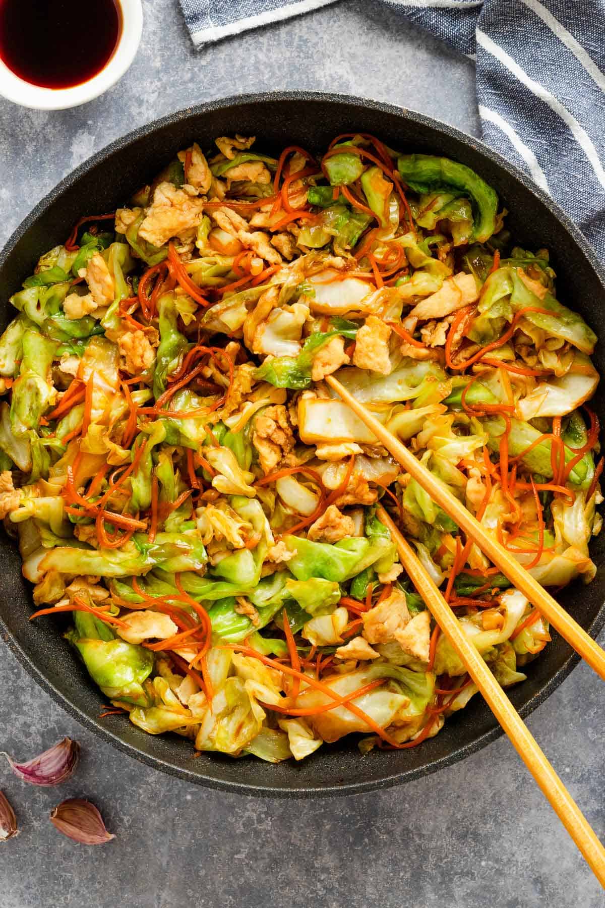 cabbage stir fry with veggies and eggs and soy sauce.