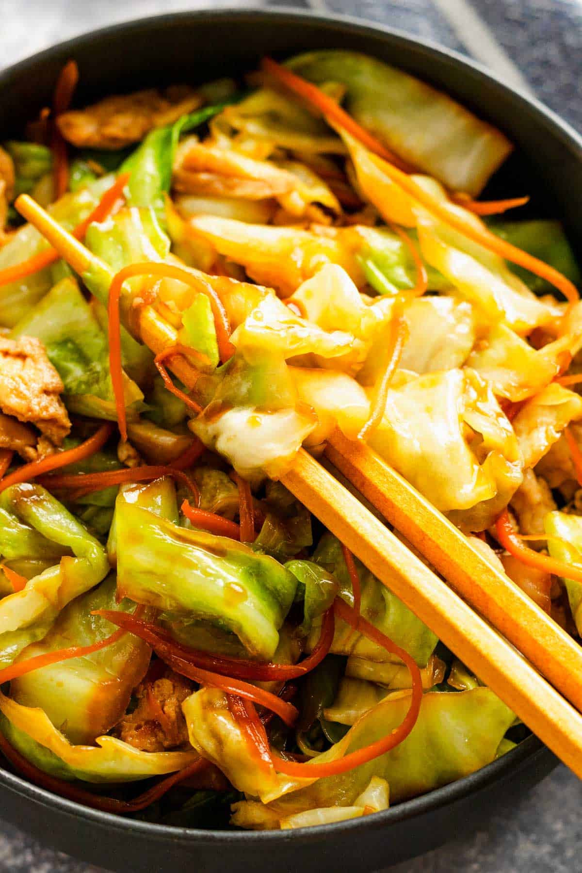 cabbage stir fry with veggies and eggs and soy sauce.