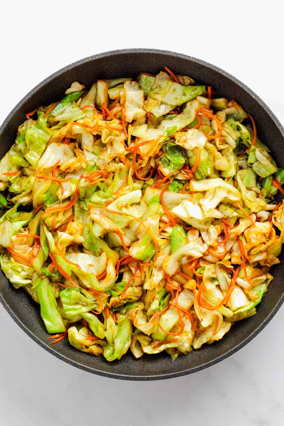 cabbage stir fry with veggies and eggs and soy sauce.