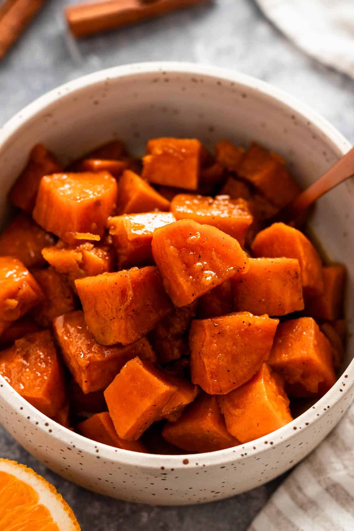 baked candied sweet potatoes in a bowl.