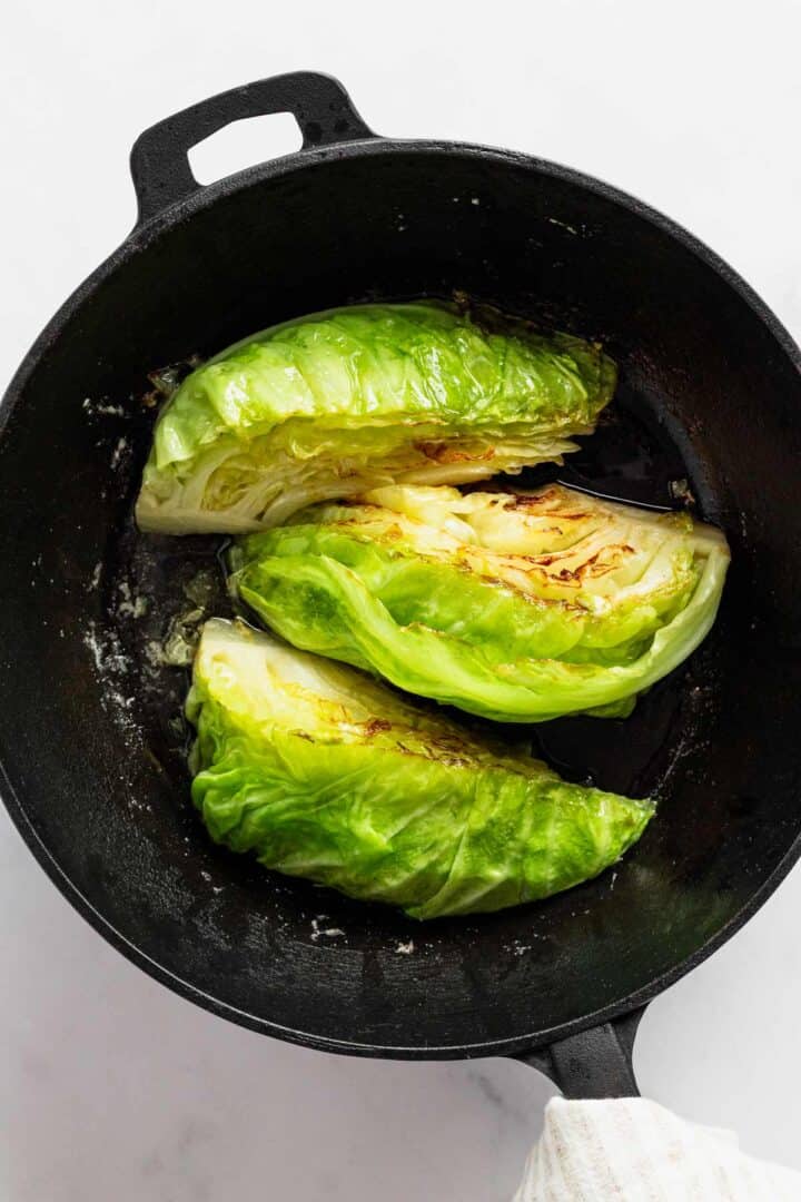 frying cabbage in skillet.