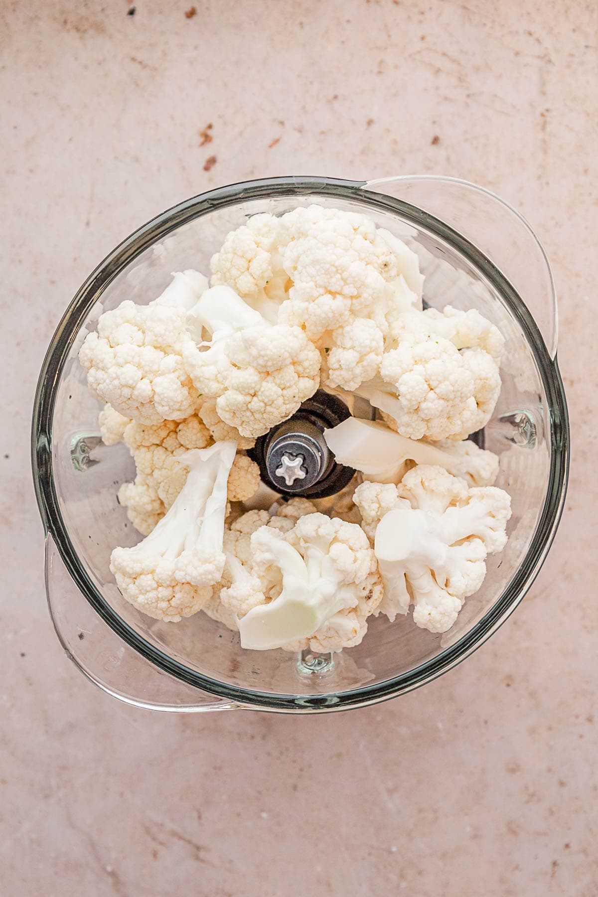 cauliflower chunks in a food processor.