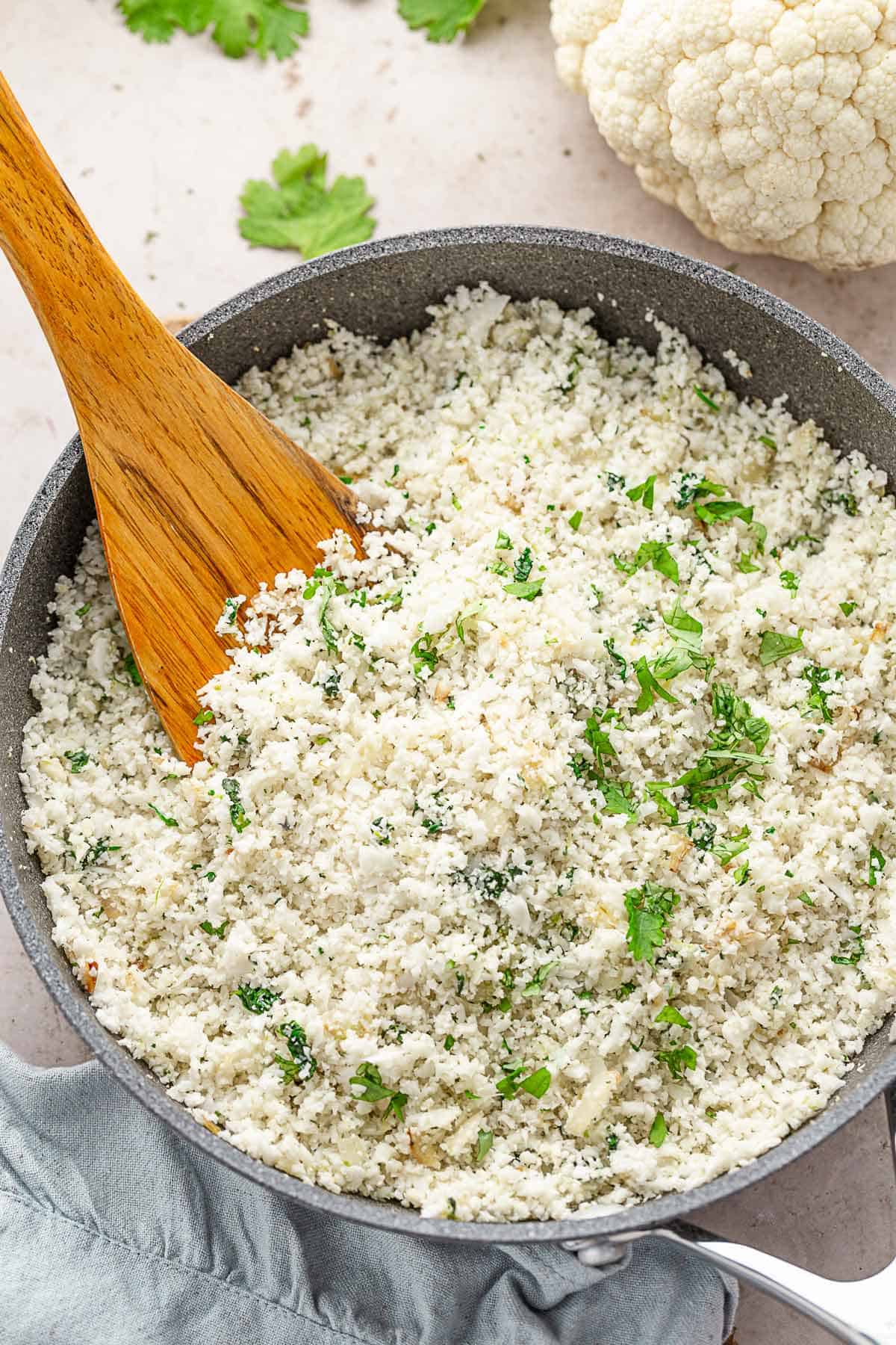 cauliflower rice with cilantro in skillet.