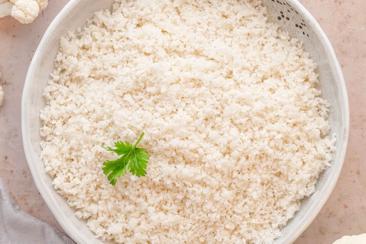 a bowl of cooked cauliflower rice.