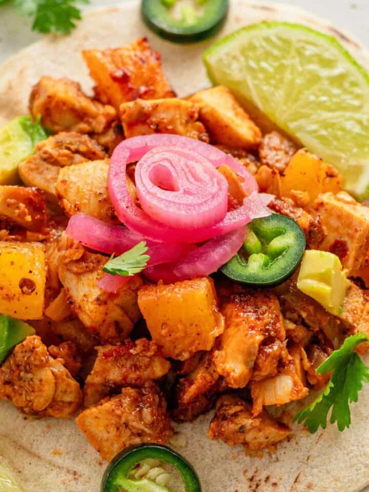 tacos with diced blackened chicken and toppings.