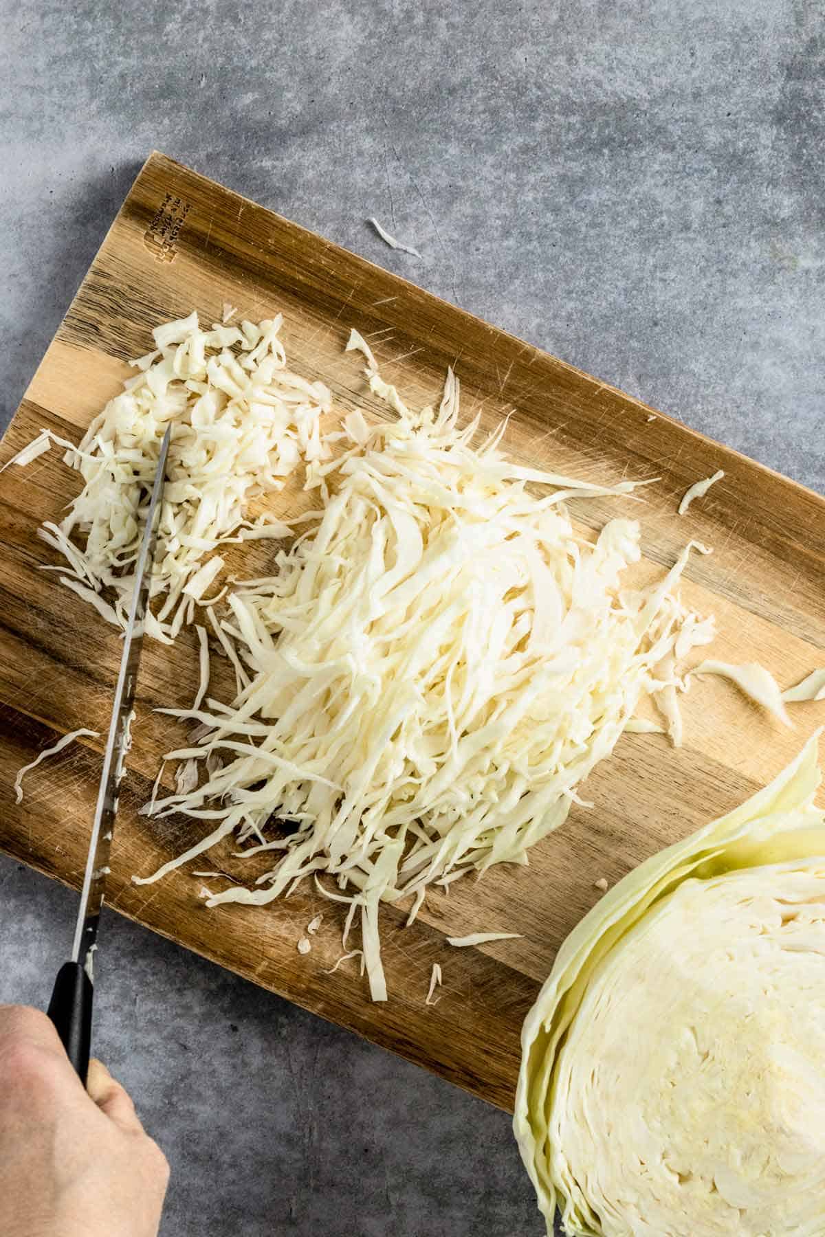 slicing caabbage on the board
