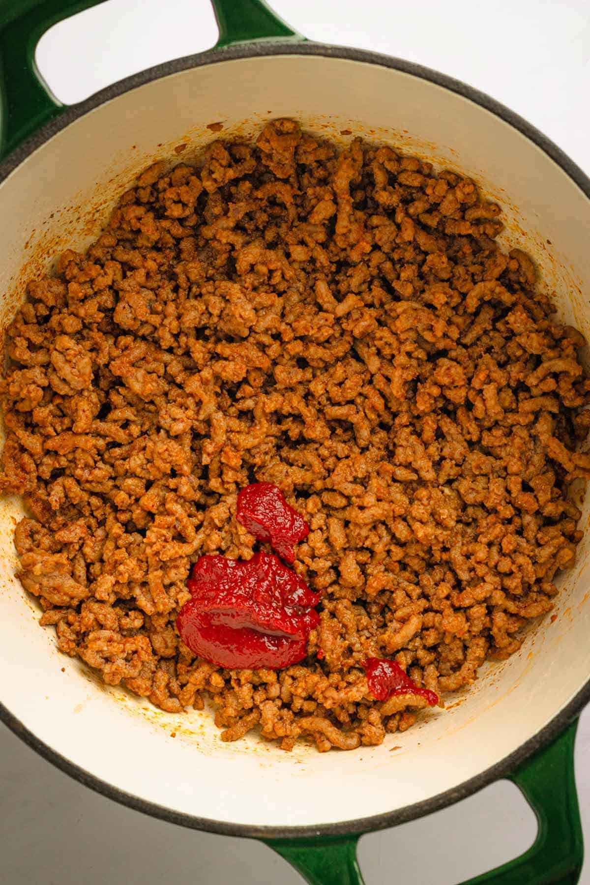 Beef and seasonings in a pot.