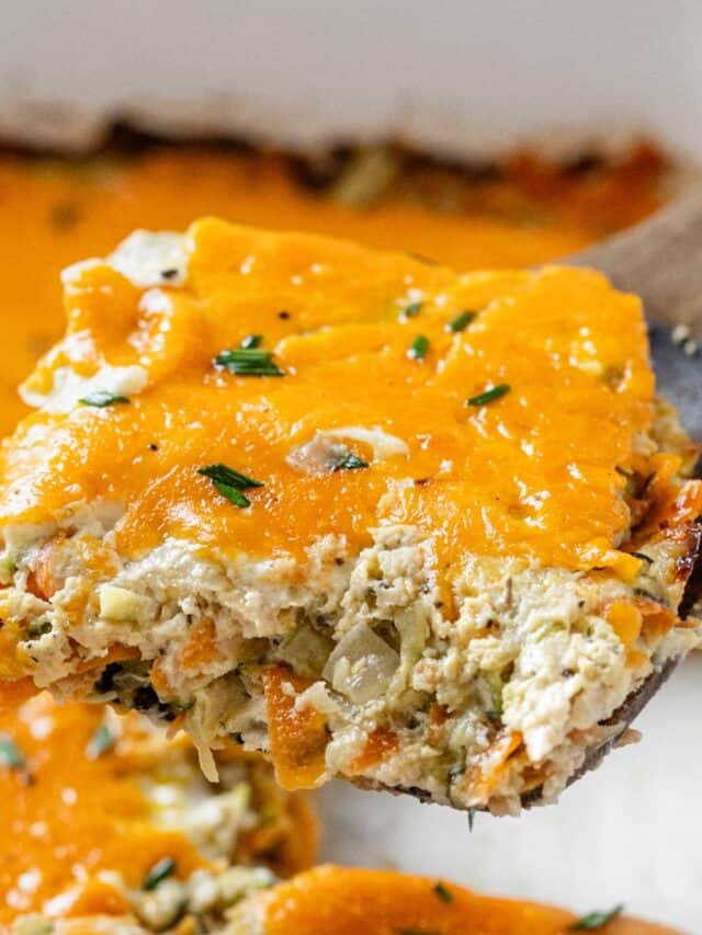 zucchini chicken casserole closeup on a wooden spoon