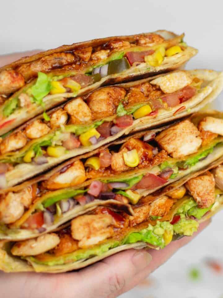 a stack of sliced chicken crunch wrap.