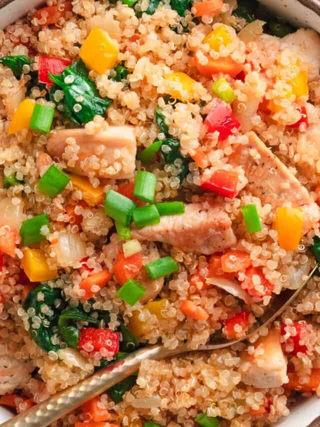 Thai chicken quinoa bowl with vegetables and green onions.