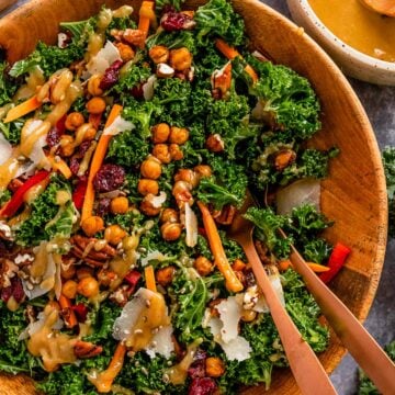 kale salad with lemon tahini dressing in a serving bowl