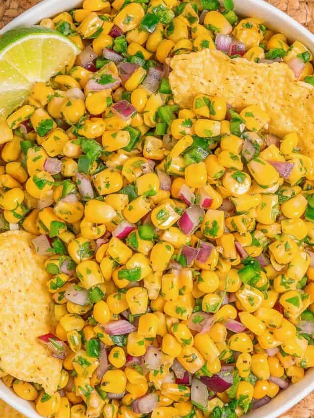 Corn salsa inspired by Chipotle served as a fresh dip with tortilla chips, overhead view.
