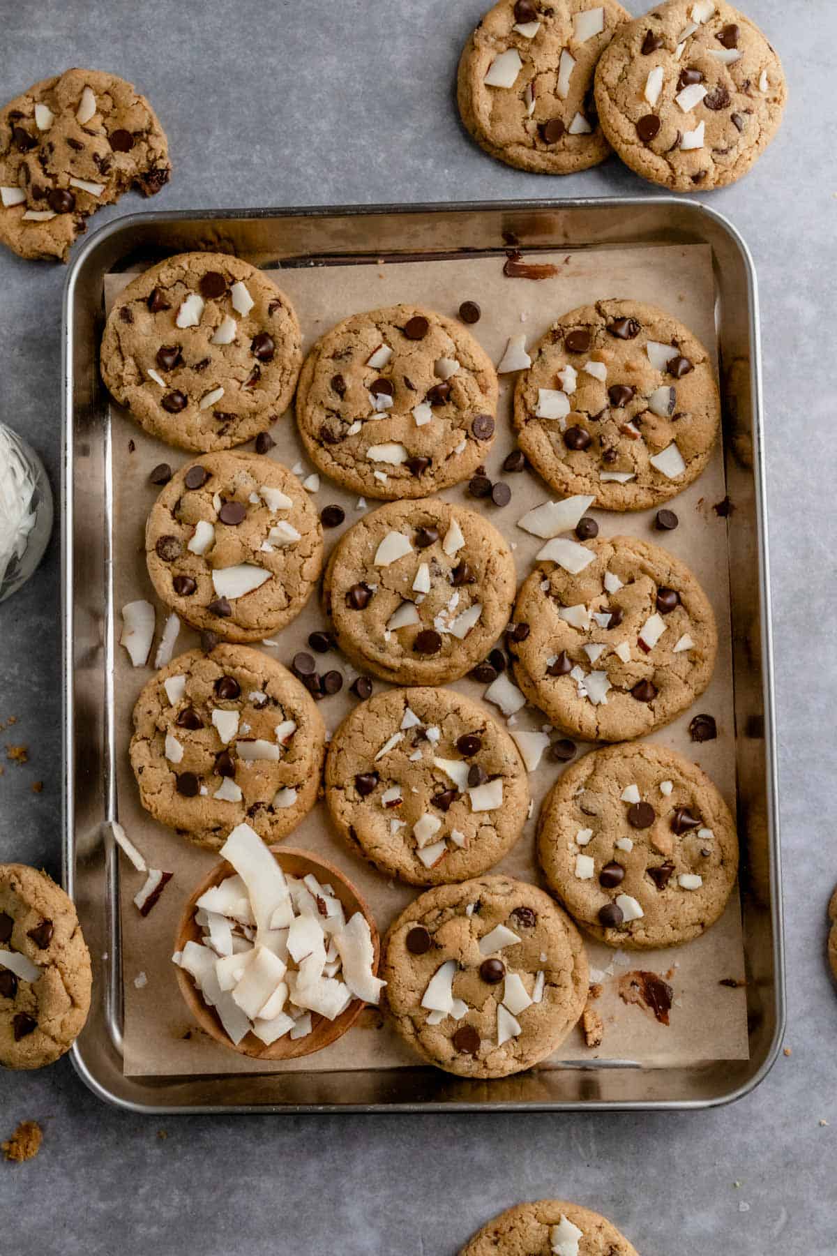 a baking sheet full of coconut chocolate chip cookies