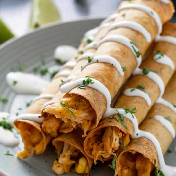 stacked creamy baked chicken taquitos