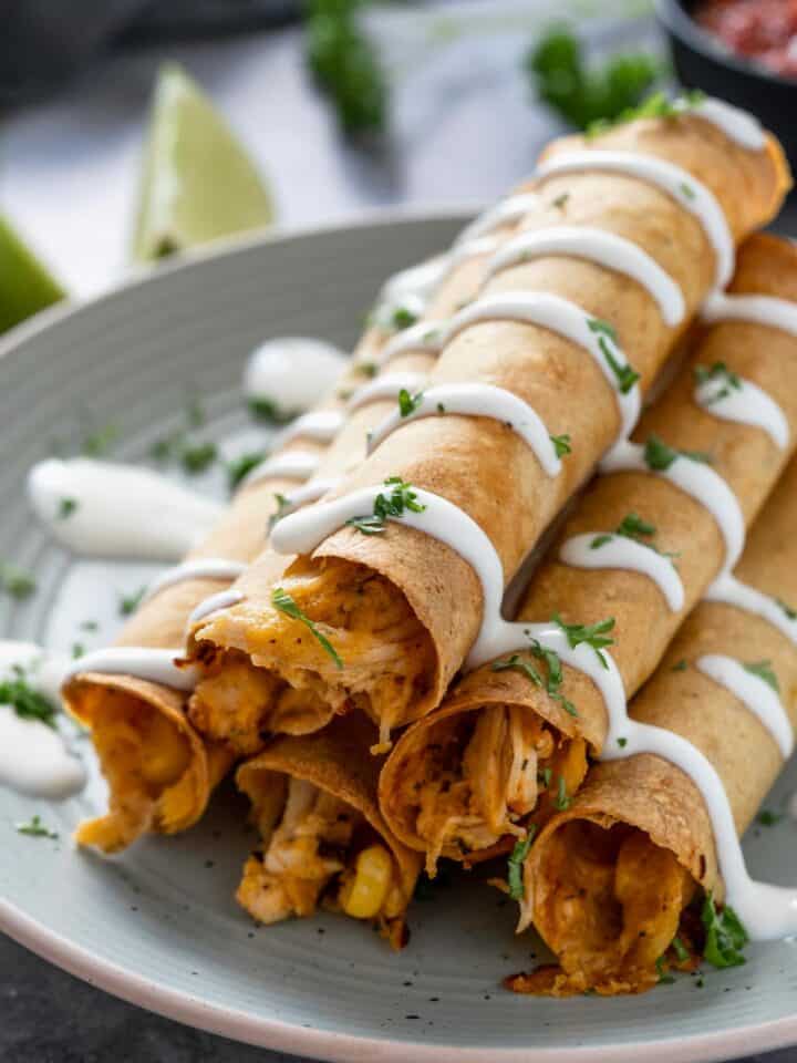 stacked creamy baked chicken taquitos