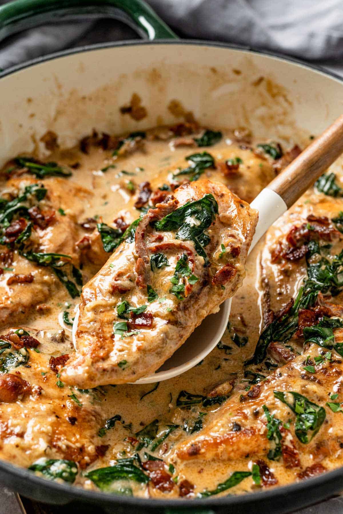 This Creamy Chicken Bacon And Spinach Pasta is one of our all-time favorite dinner recipes. Tender juicy chicken over pasta in a rich creamy sauce with spinach and bacon. An excellent easy weeknight or weekend dinner recipe for the whole family. Yum! - The Yummy Bowl