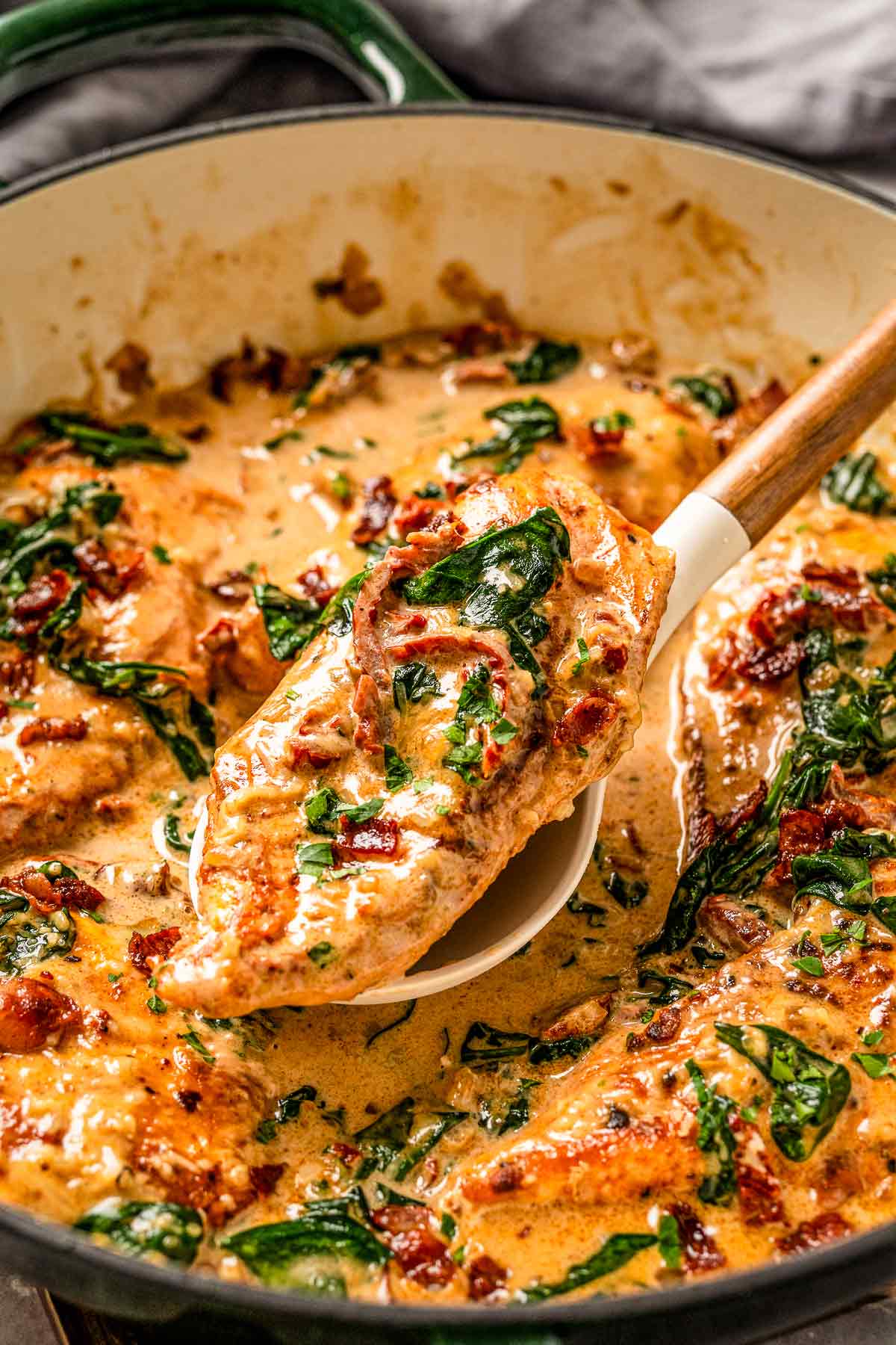 This Creamy Chicken Bacon And Spinach Pasta is one of our all-time favorite dinner recipes. Tender juicy chicken over pasta in a rich creamy sauce with spinach and bacon. An excellent easy weeknight or weekend dinner recipe for the whole family. Yum! - The Yummy Bowl