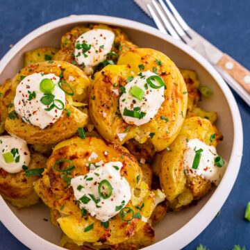 Crispy Smashed Potatoes In Oven With Garlic Butter and sour cream