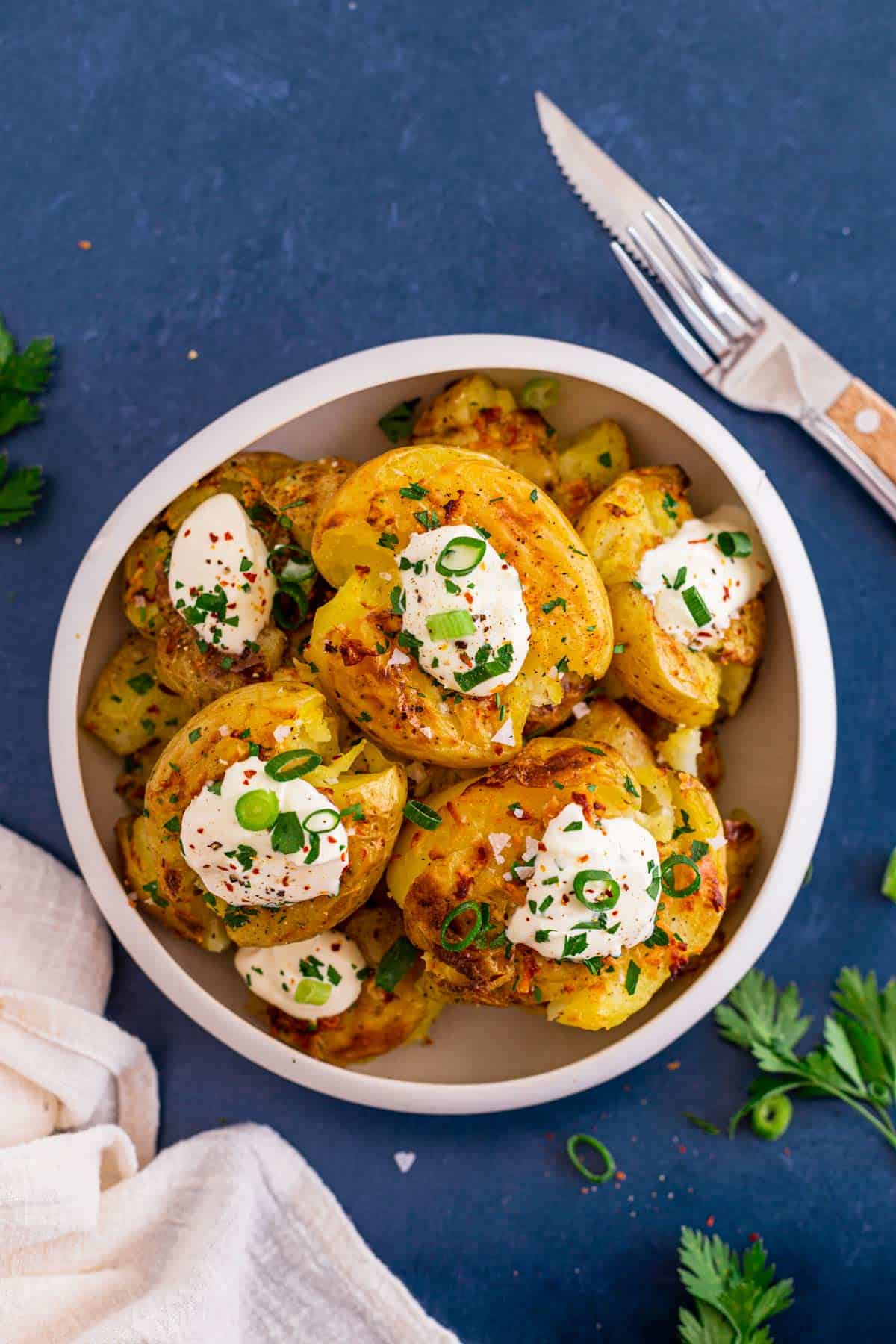 Crispy Smashed Potatoes In Oven With Garlic Butter and sour cream