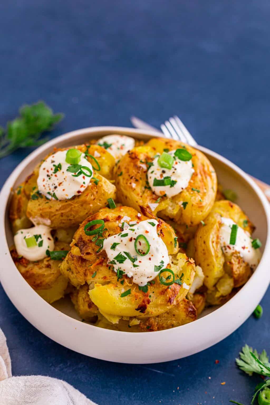 crispy-smashed-potatoes-in-oven-with-garlic-butter-the-yummy-bowl