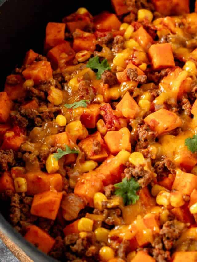 ground beef and sweet potatoes in skillet with cheese.