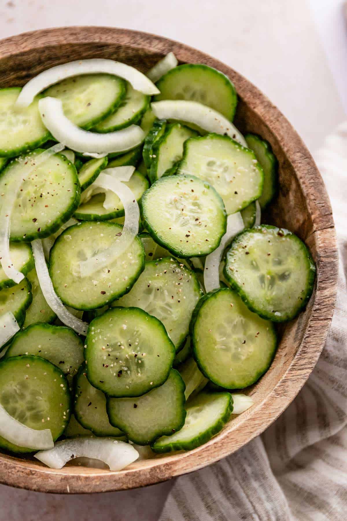 A bowl of Cucumbers and Onions In Vinegar