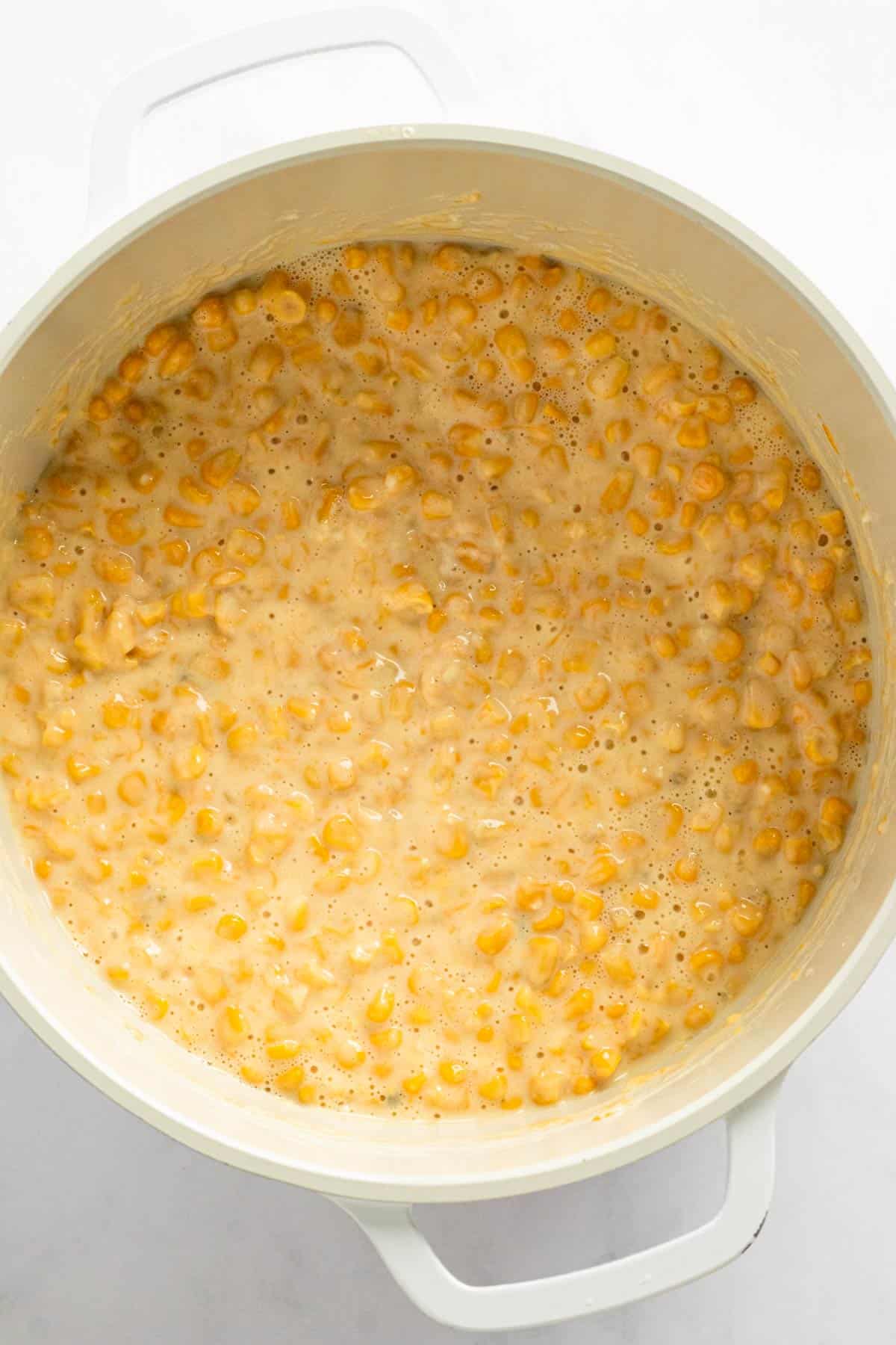creamy corn in white sauce pot.