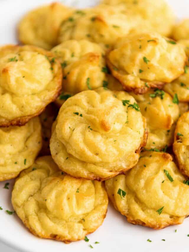 a stack of duchess potatoes on a plate