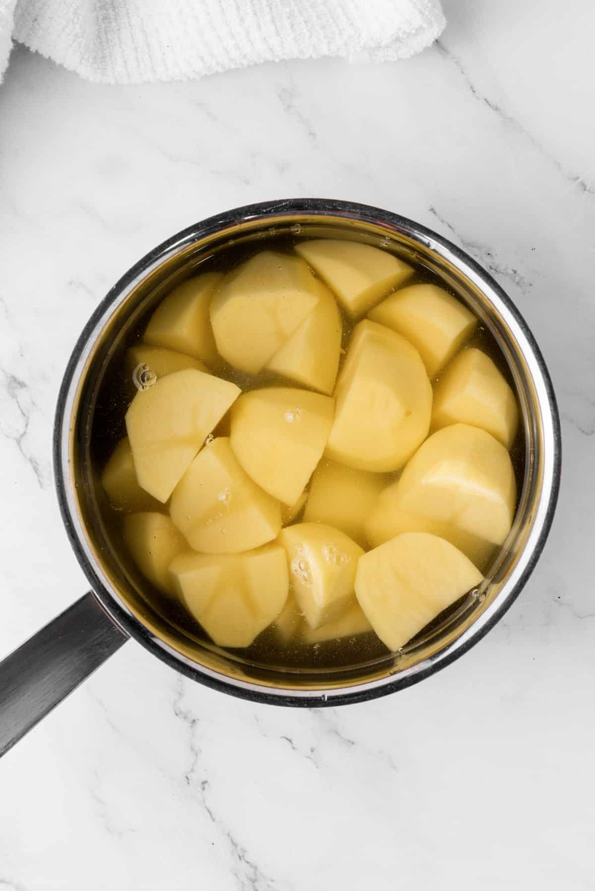 boiled potatoes in saucepot
