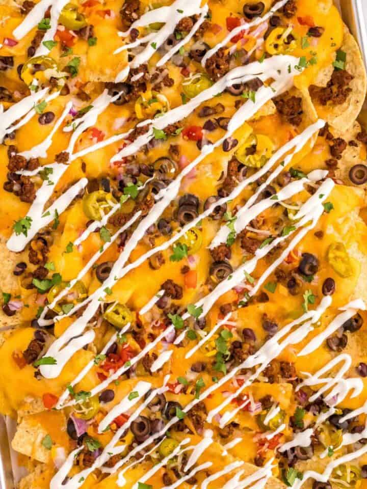 loaded cheesy easy taco meat sheet pan nachos.