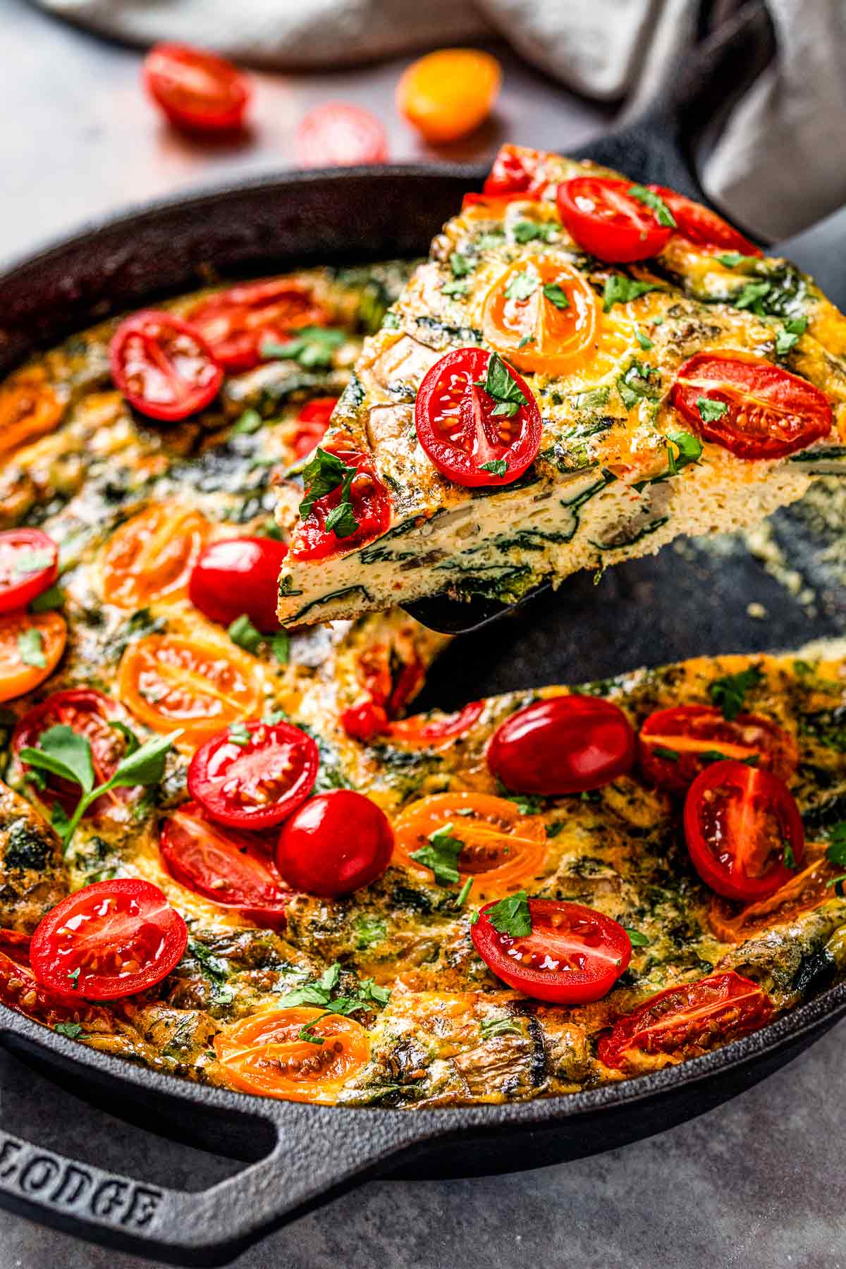 healthy vegetable frittata with spinach and tomatoes.