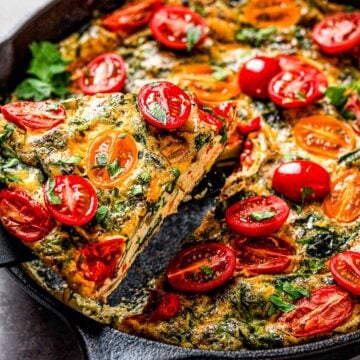 healthy vegetable frittata with spinach and tomatoes.