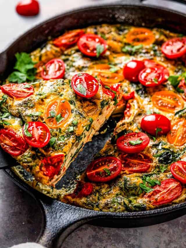 healthy vegetable frittata with spinach and tomatoes.