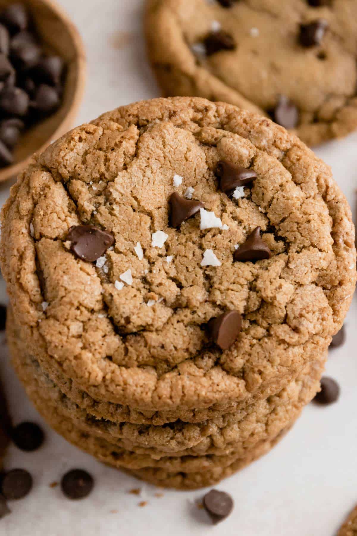 a tower of gluten free chocolate chip cookies with sea salt flakes