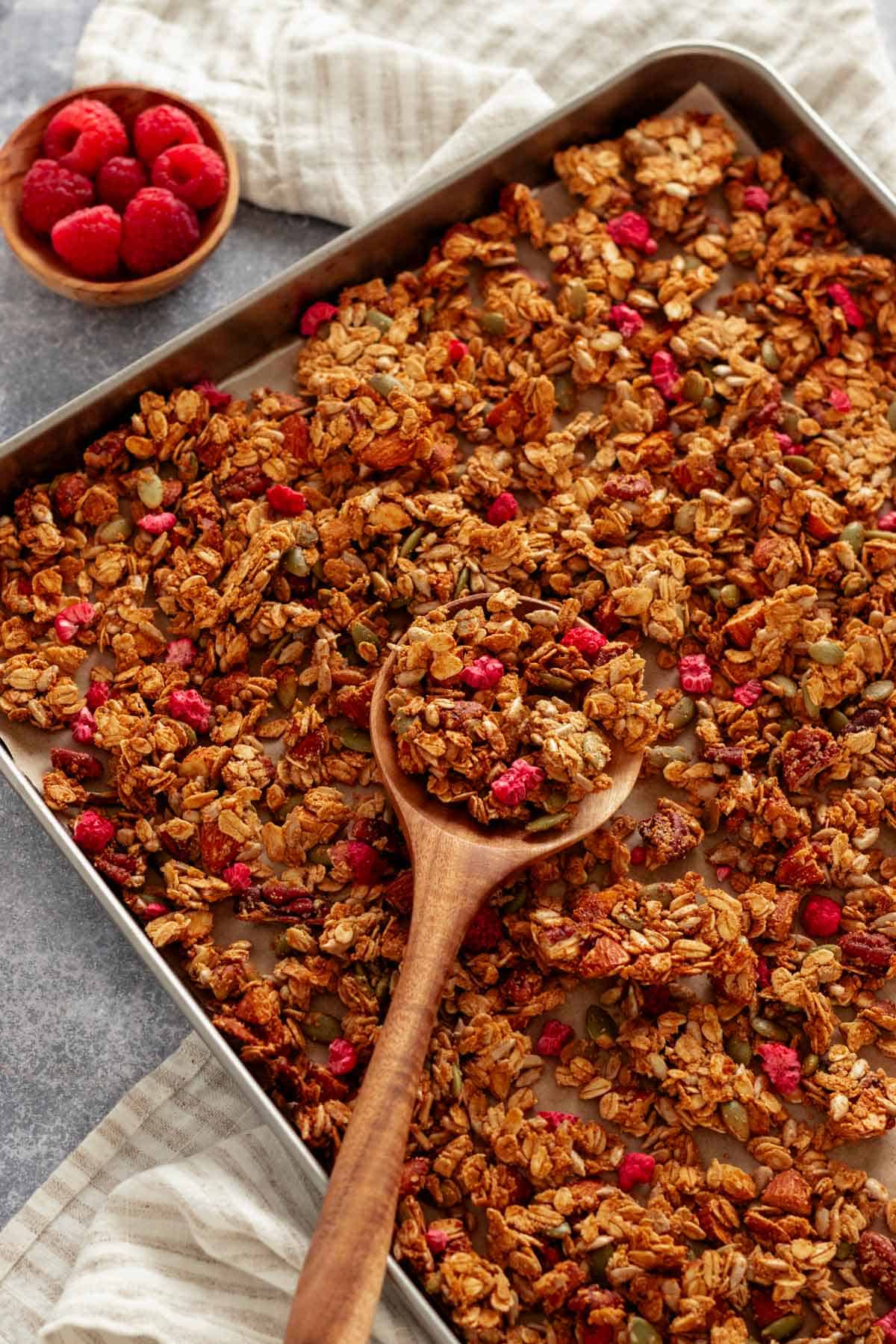 baked crunchy granola clusters on baking sheet