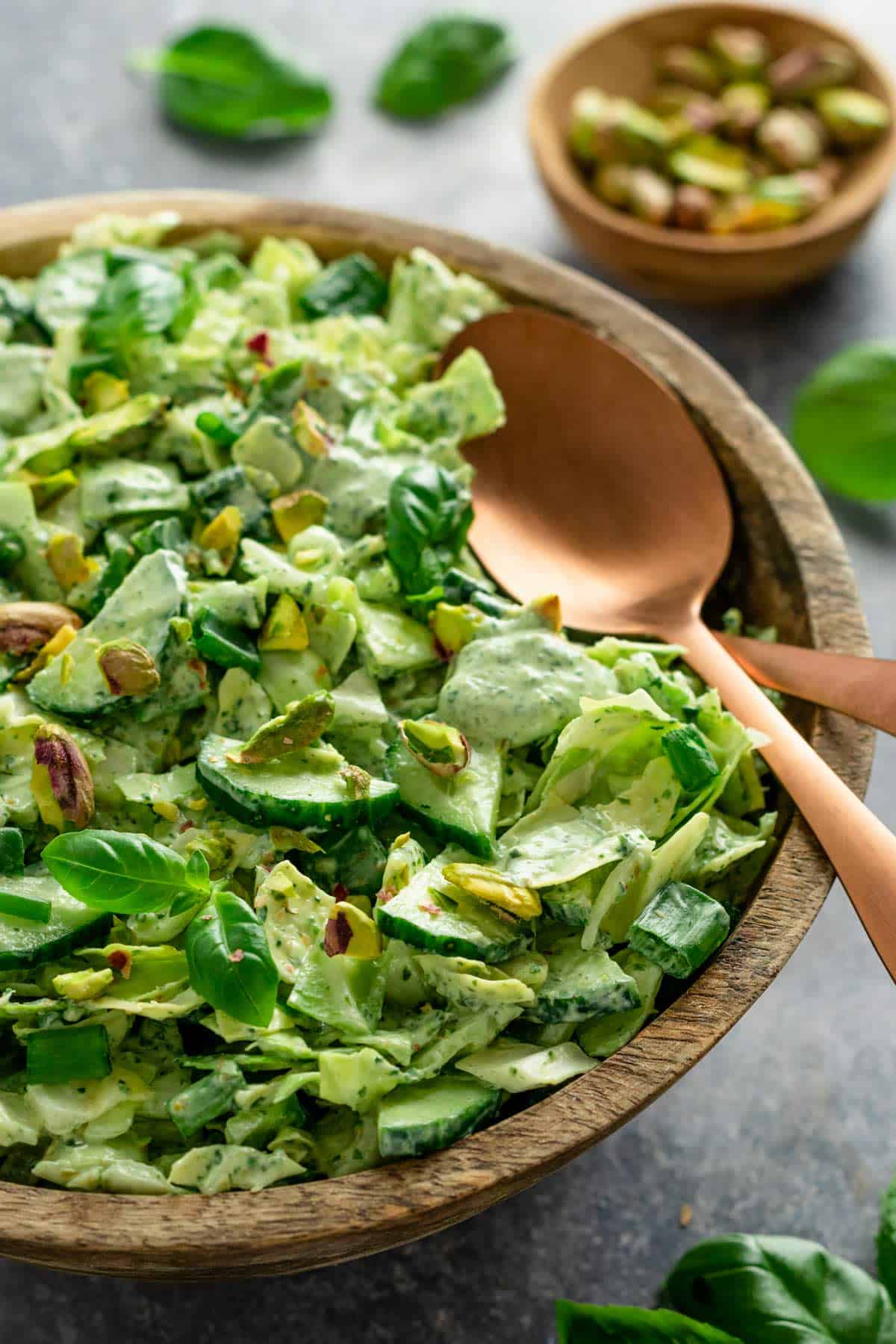 green goddess salad in a bowl with green creamy dressing