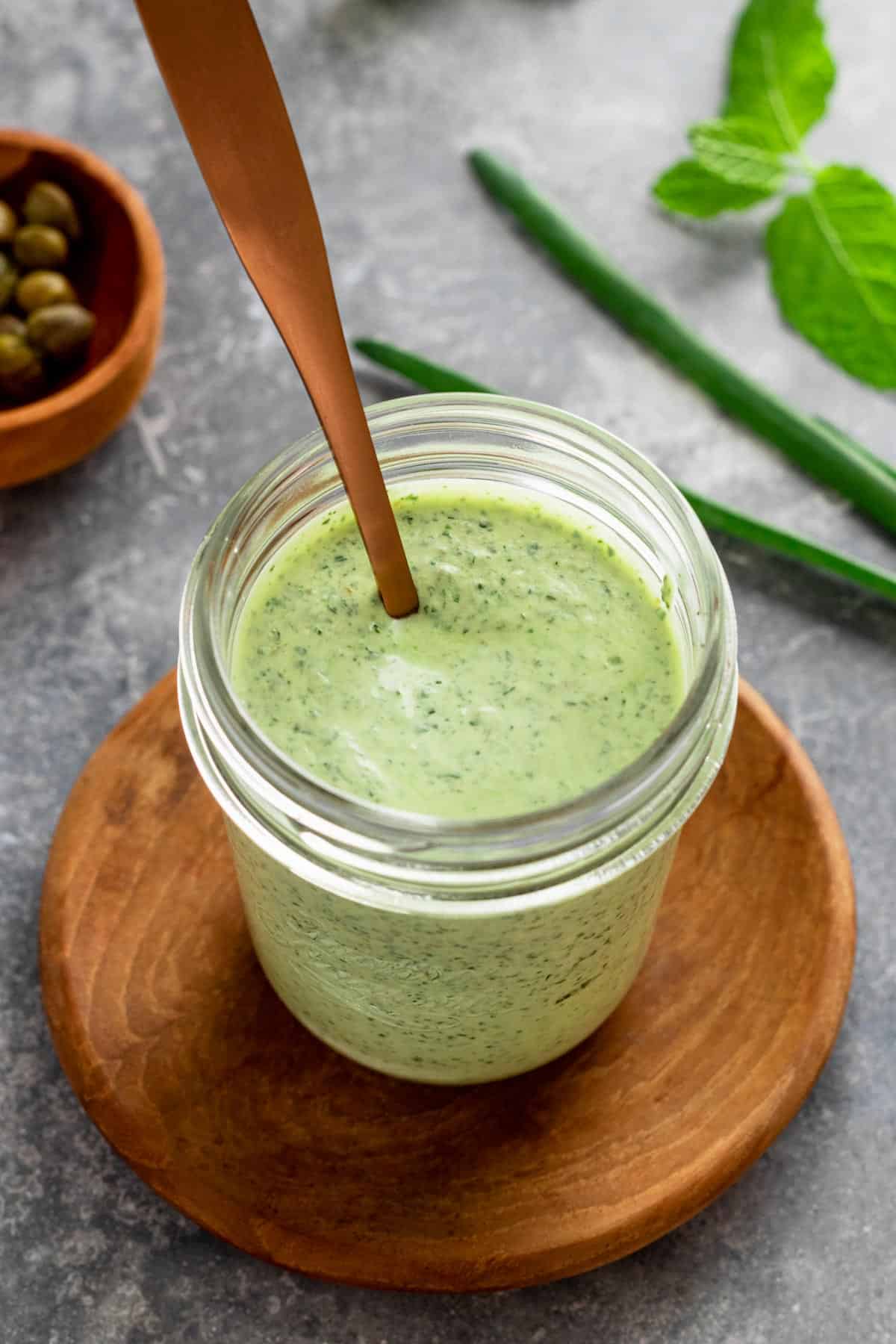 green herby dressing in a jar
