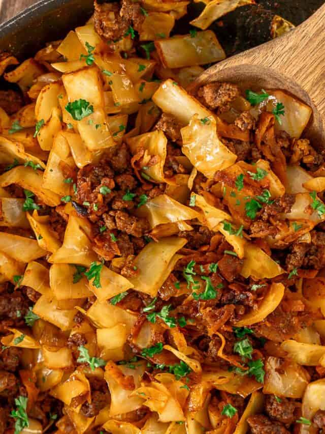 fried ground beef and cabbage in a white bowl angle shot