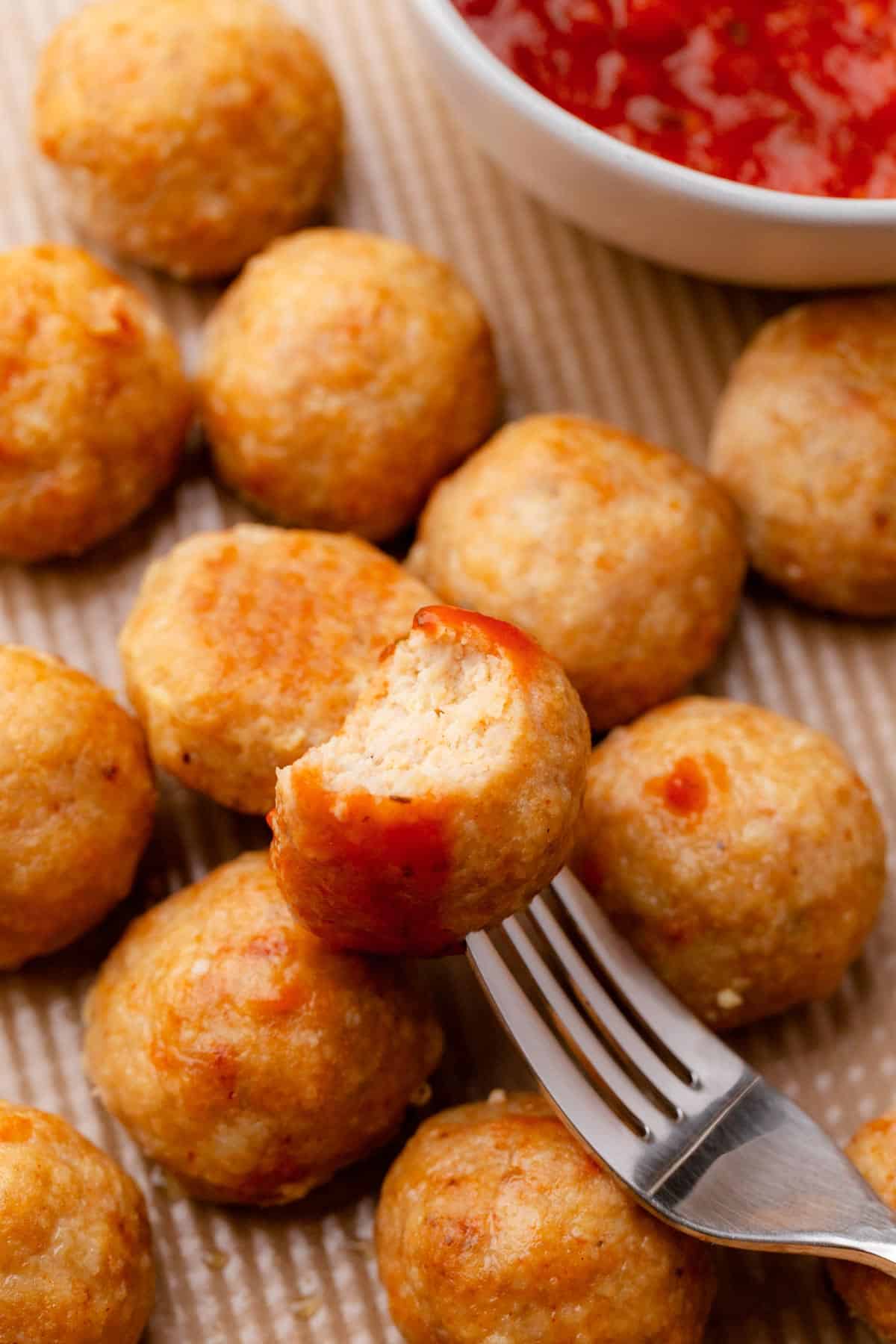 Golden brown ground chicken meatballs.