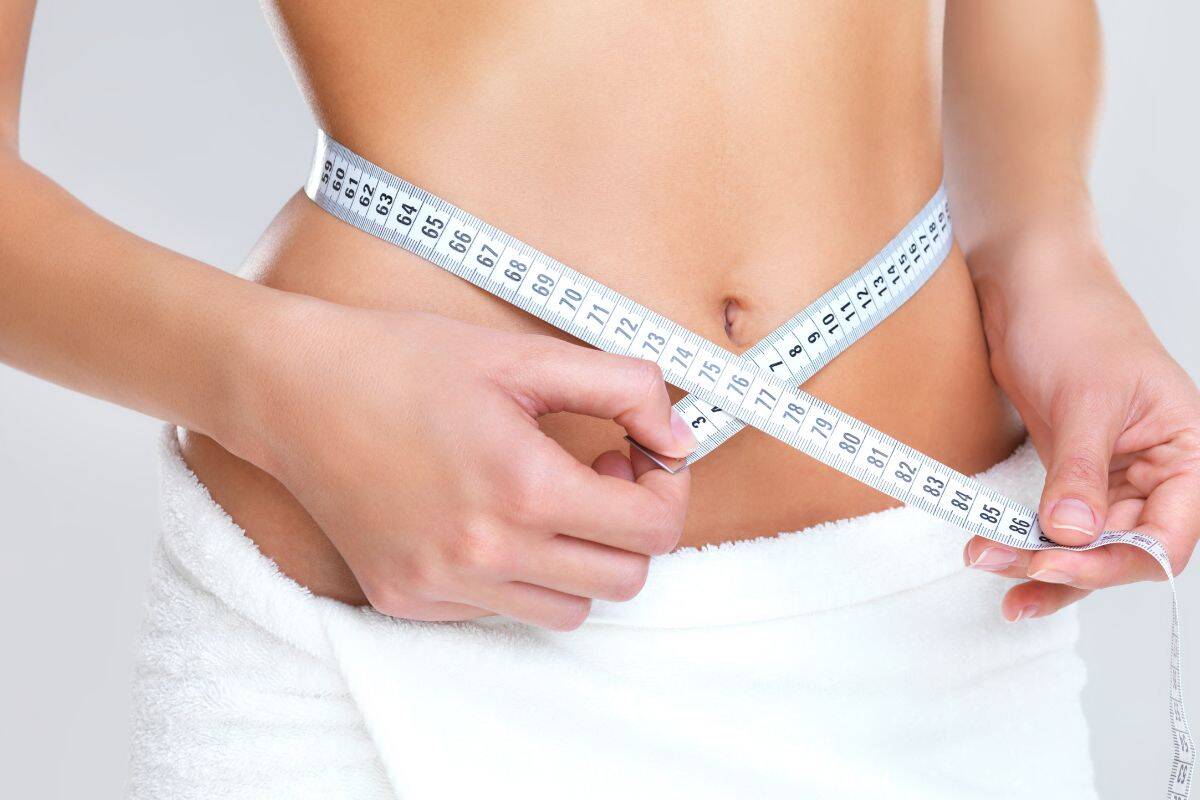 A slim womans figure.