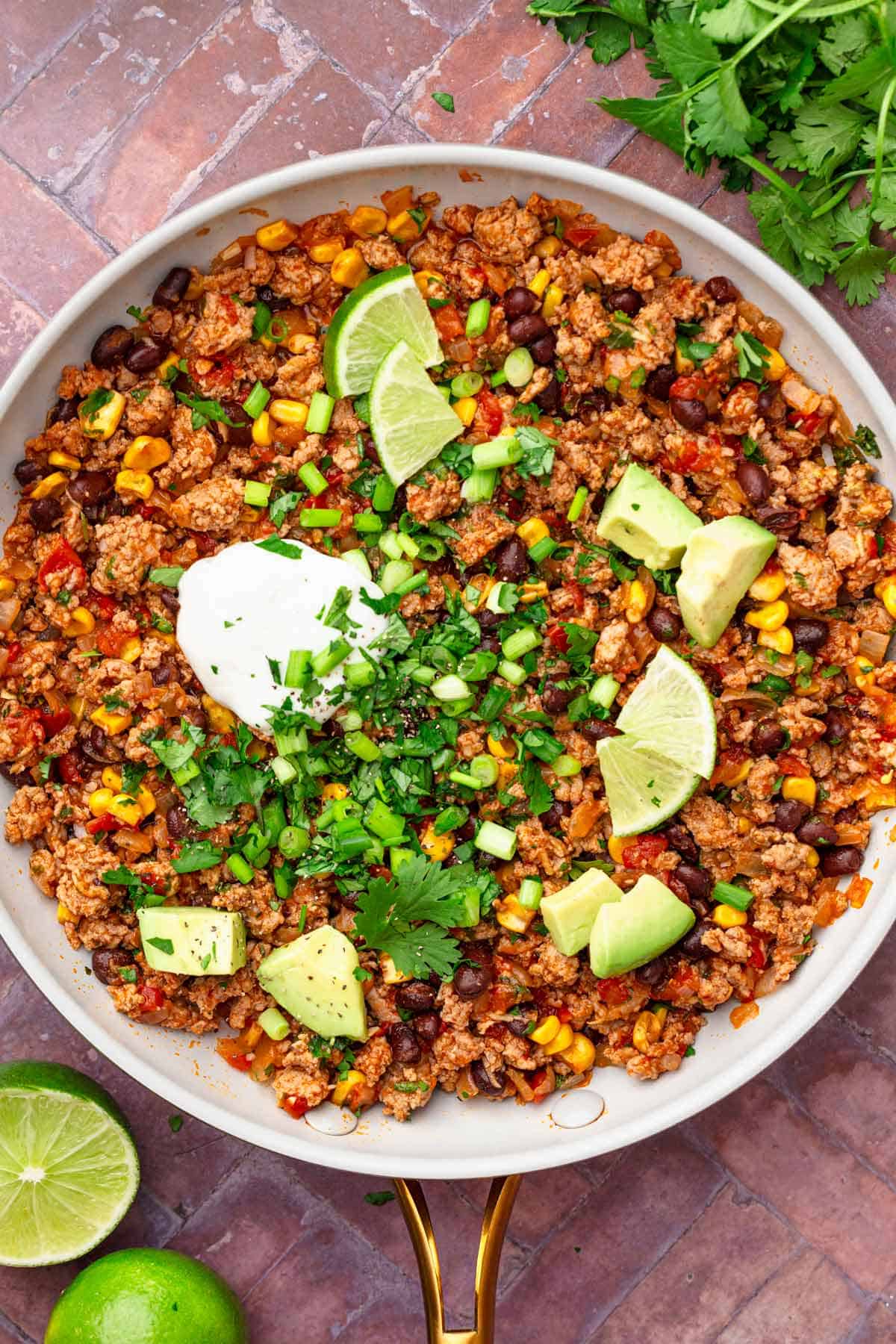 Easy ground turkey skillet with beans and avocado.