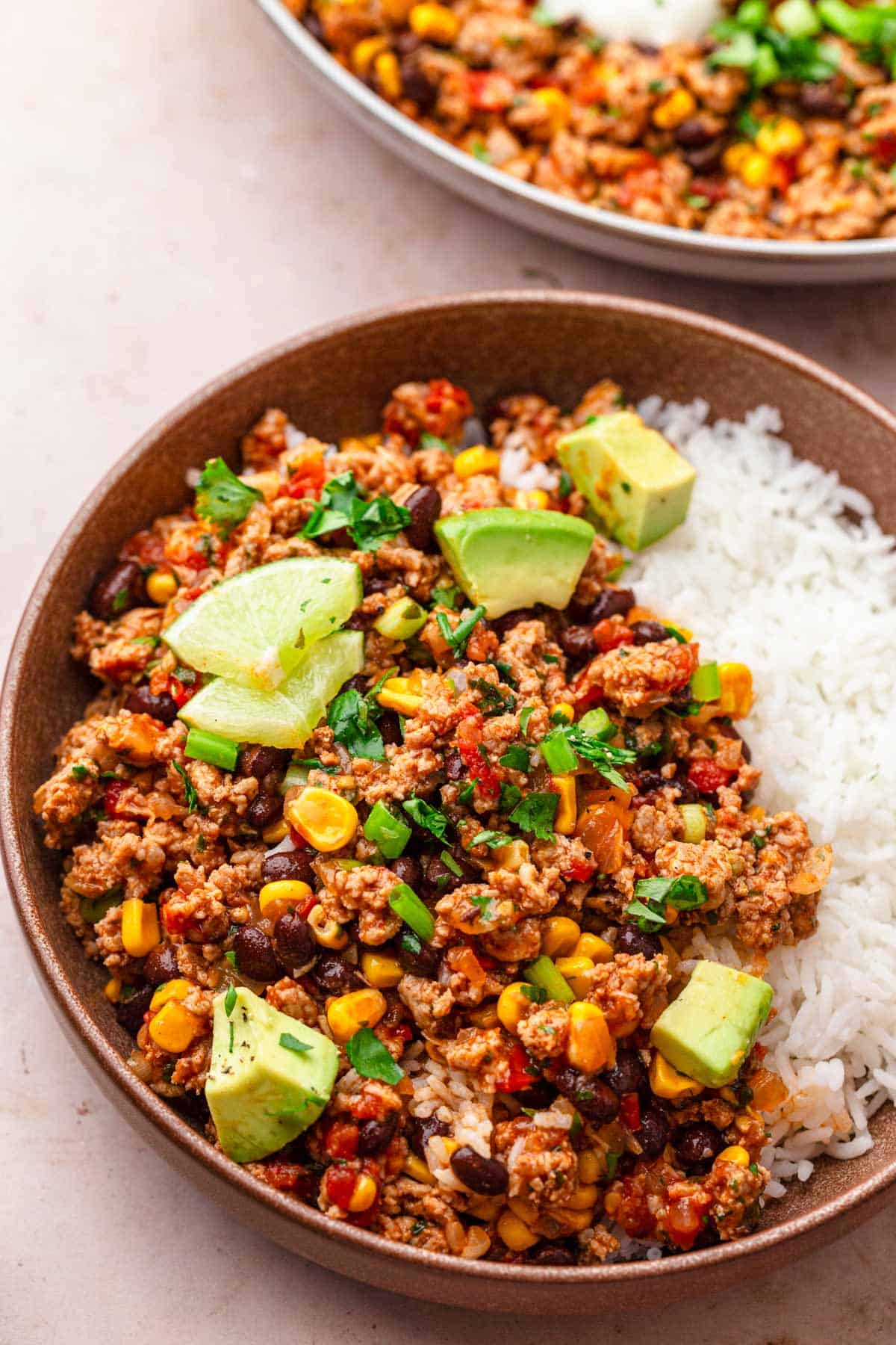 A bowl of delicious ground turkey taco dinner with rice.