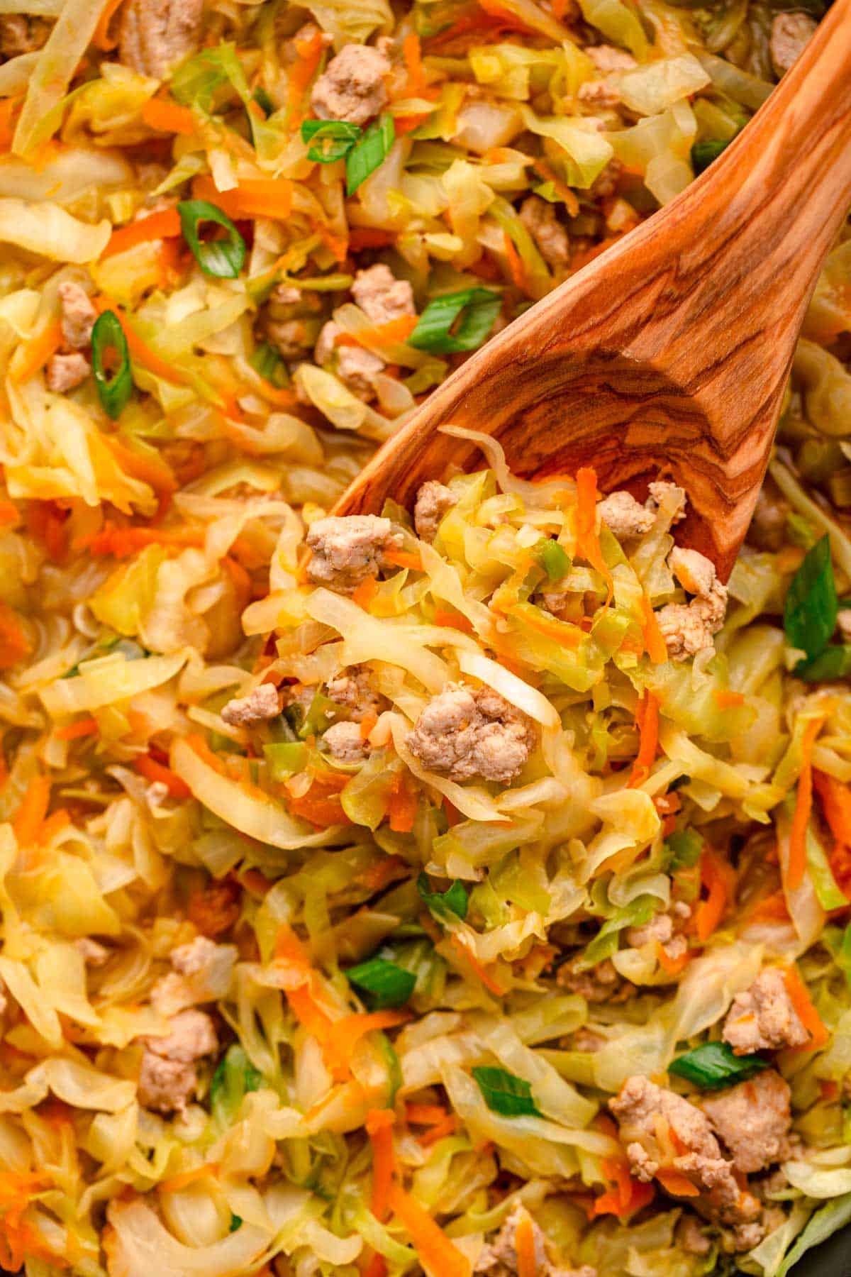 Ground turkey cabbage stir fry with sriracha and sesame seeds.