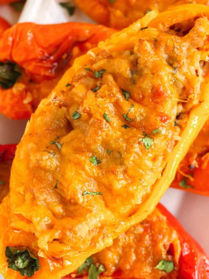 a bunch of cheesy turkey stuffed peppers.