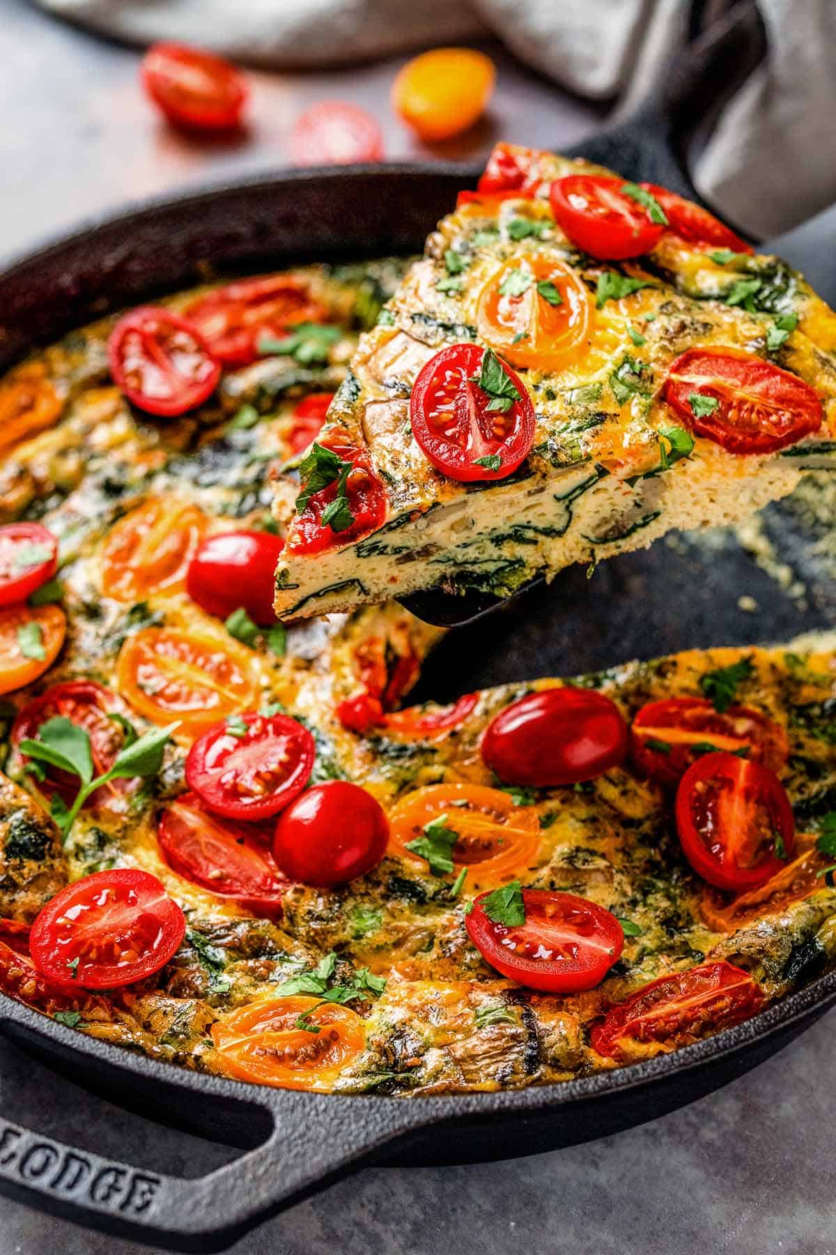 healthy vegetable frittata with spinach and tomatoes.