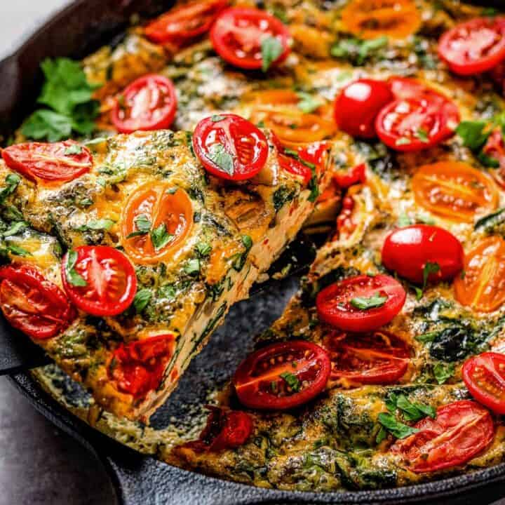healthy vegetable frittata with spinach and tomatoes.
