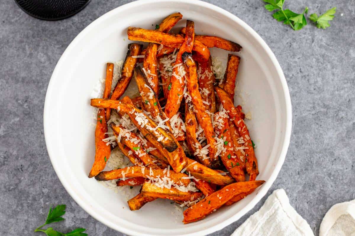 sweet potato fries in bowl with parmesan.